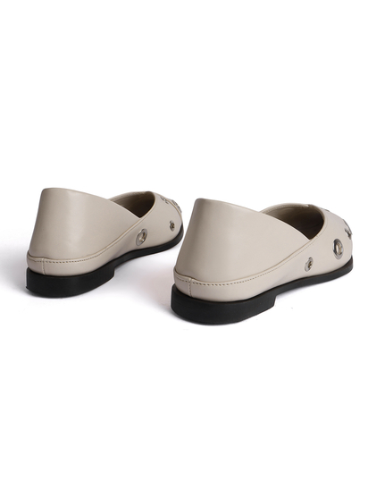 Cream pointed flats with grommets