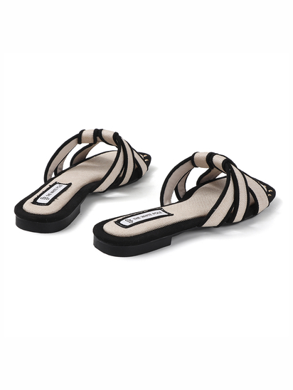 White Black two-tone canvas slides with woven straps and studded trim Flats
