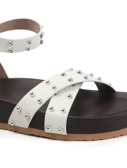 White Open-Toe Flats With Silver Studs and Criss-Cross Ankle Strap Design