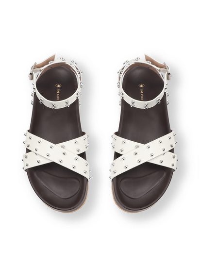 White Open-Toe Flats With Silver Studs and Criss-Cross Ankle Strap Design